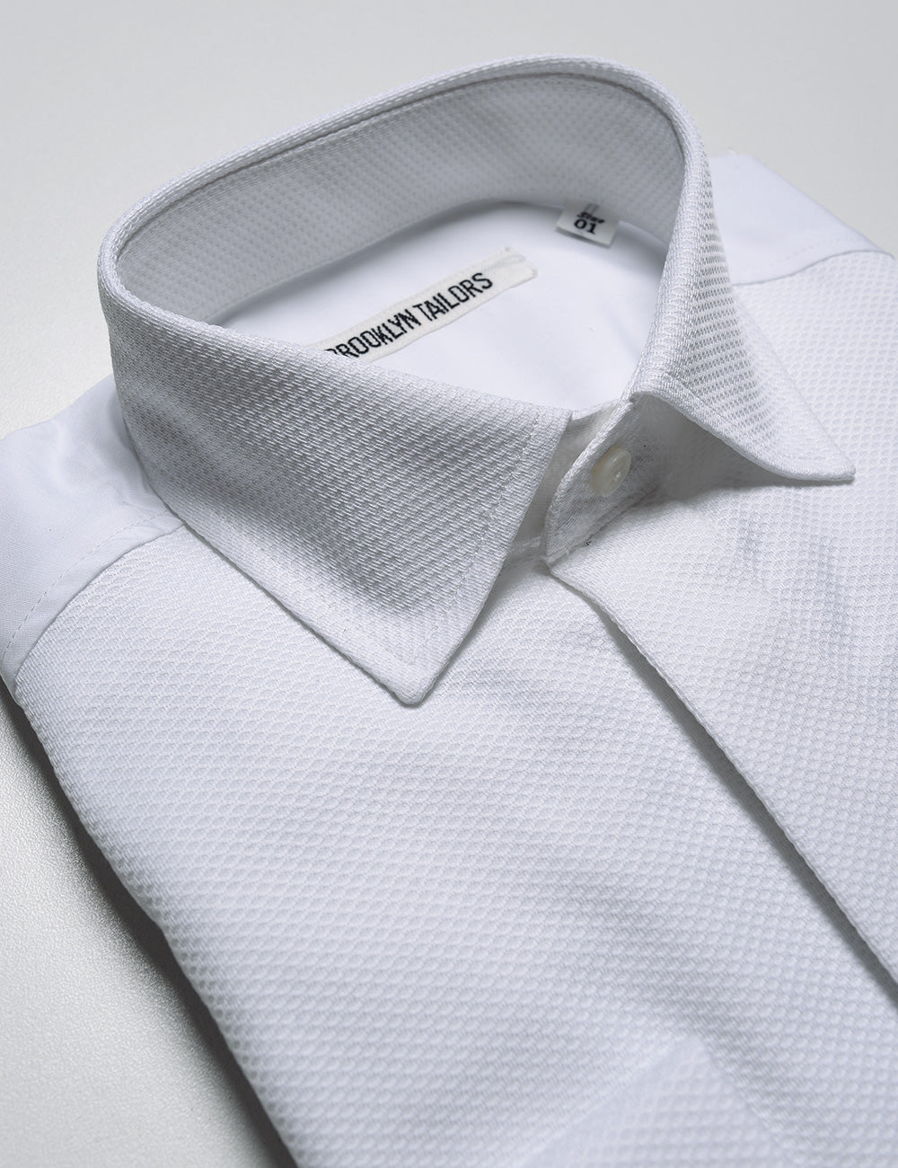 Detail shot of collar and placket on Brooklyn Tailors BKT20 Classic French Cuff Tuxedo Shirt -  Waffle Pique