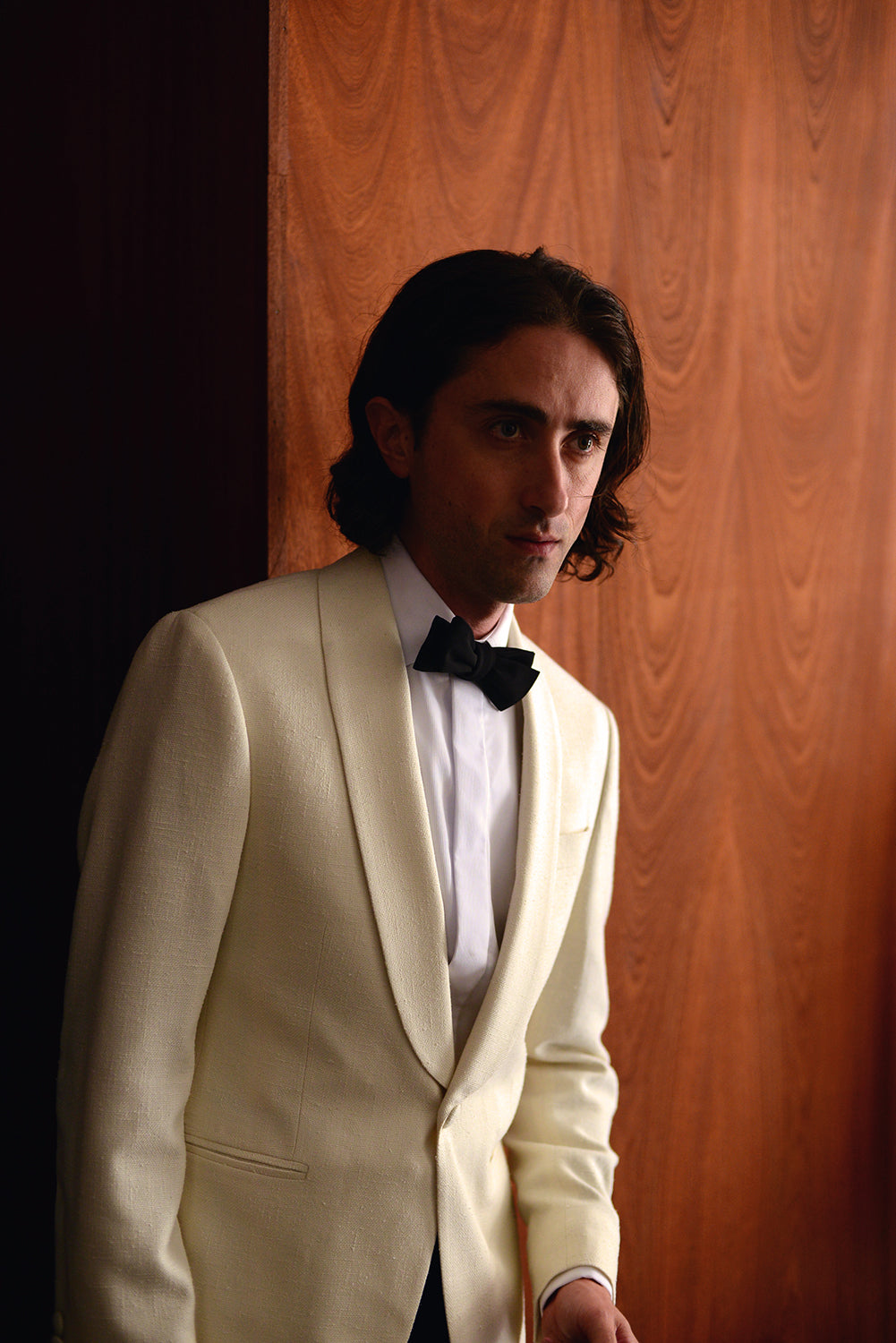 Brooklyn Tailors BKT50 Shawl Collar Dinner Jacket in Silk & Wool Hopsack - Ivory on-body shot. Model is wearing jacket with white tuxedo shirt and black bowtie.
