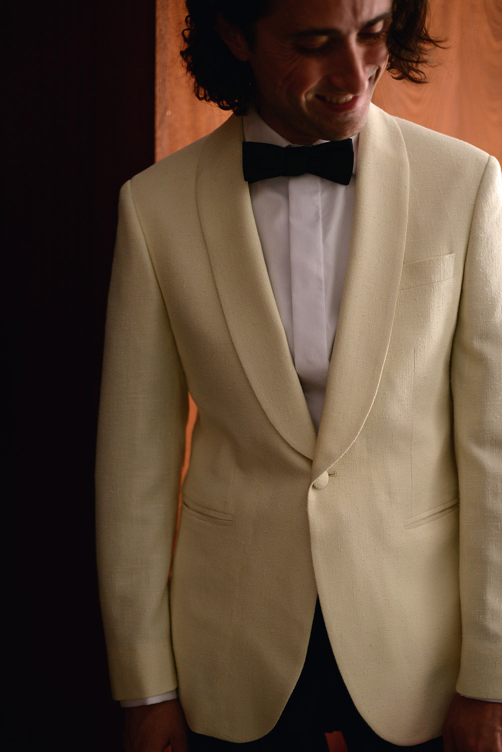 Brooklyn Tailors BKT50 Shawl Collar Dinner Jacket in Silk & Wool Hopsack - Ivory on-body shot. Model is wearing the jacket with a white tux shirt and black bowtie