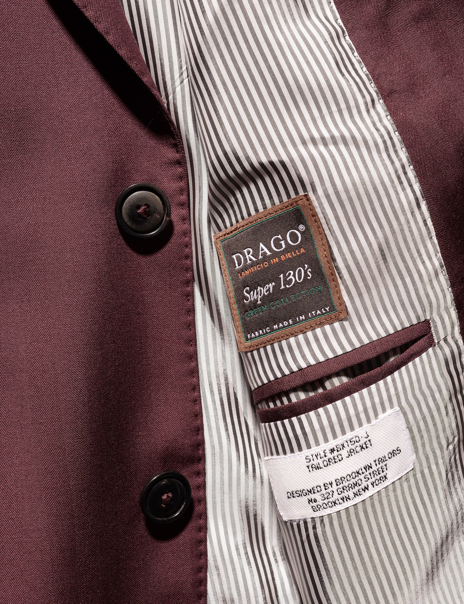 Detail shot of Brooklyn Tailors BKT50 Tailored Jacket in Wool Herringbone - Syrah showing buttons and Drago label 