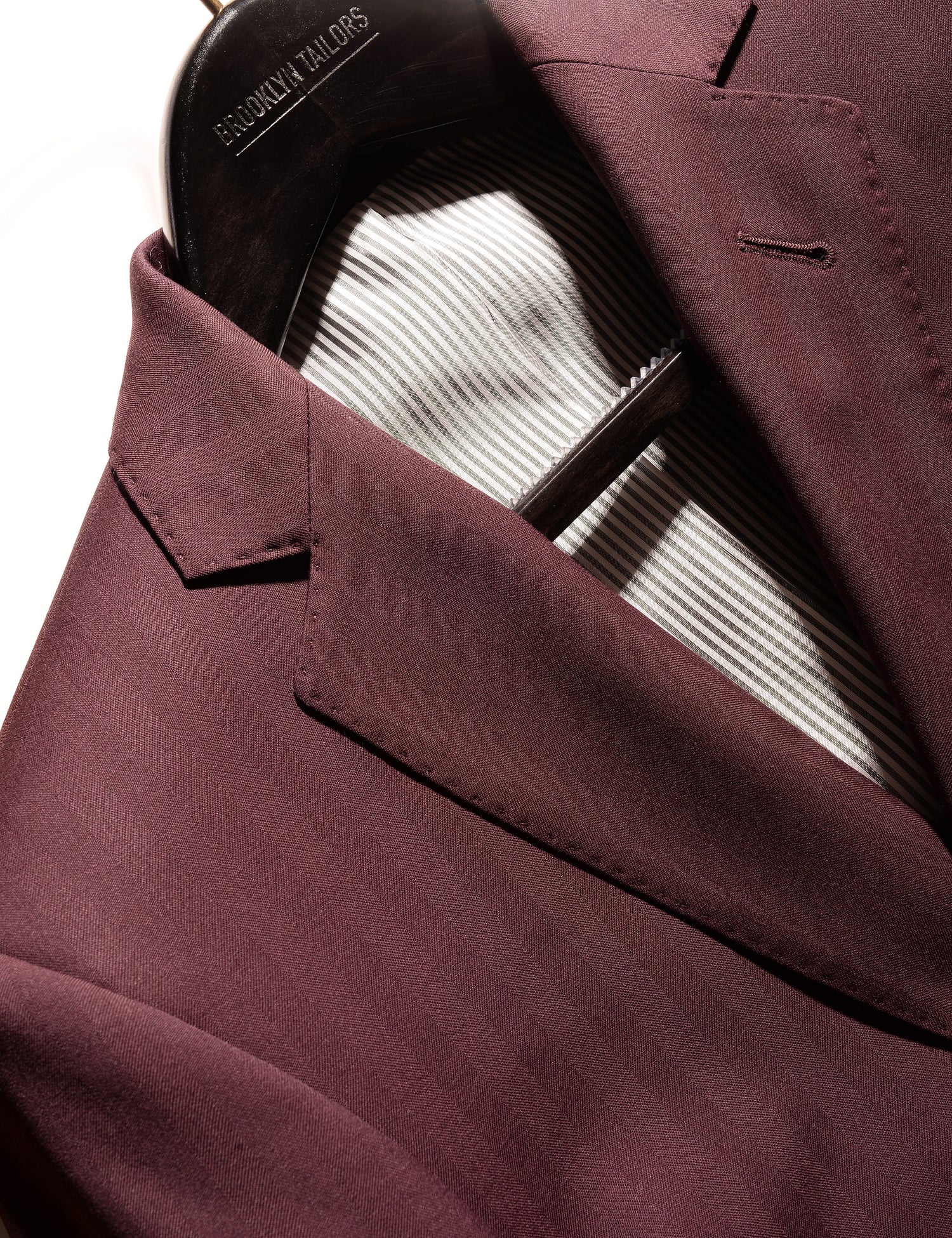 Detail shot of Brooklyn Tailors BKT50 Tailored Jacket in Wool Herringbone - Syrah showing lapel and fabric texture