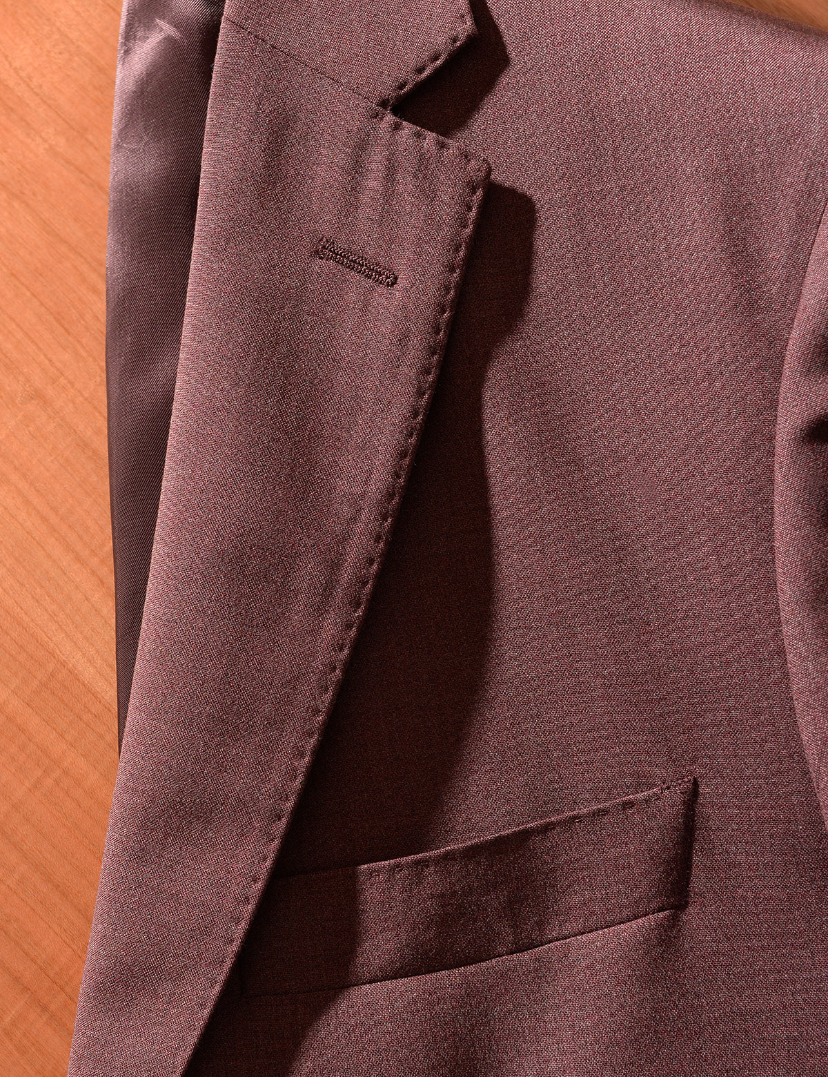 Detail shot of Brooklyn Tailors BKT50 Tailored Jacket in 14.5 Micron Mouliné - Cordovan showing lapel, pocket, and fabric texture