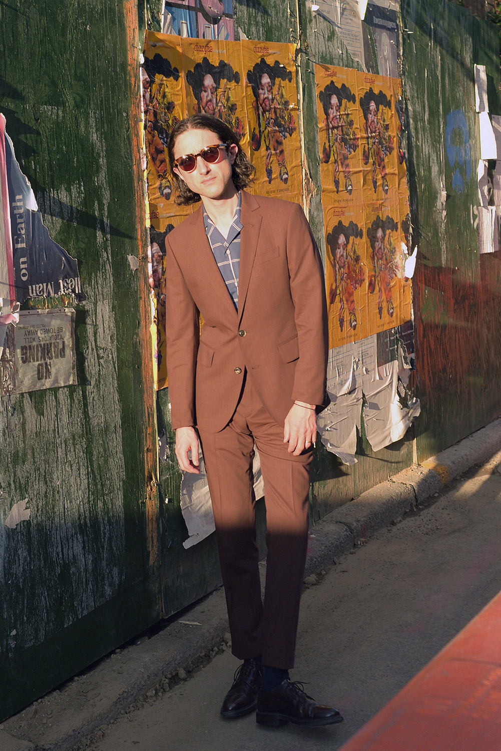 Brooklyn Tailors BKT50 Tailored Jacket in Herringbone Wool/Cotton - Brick on-body shot. Model is wearing jacket with matching pants, blue check shirt, and dress shoes
