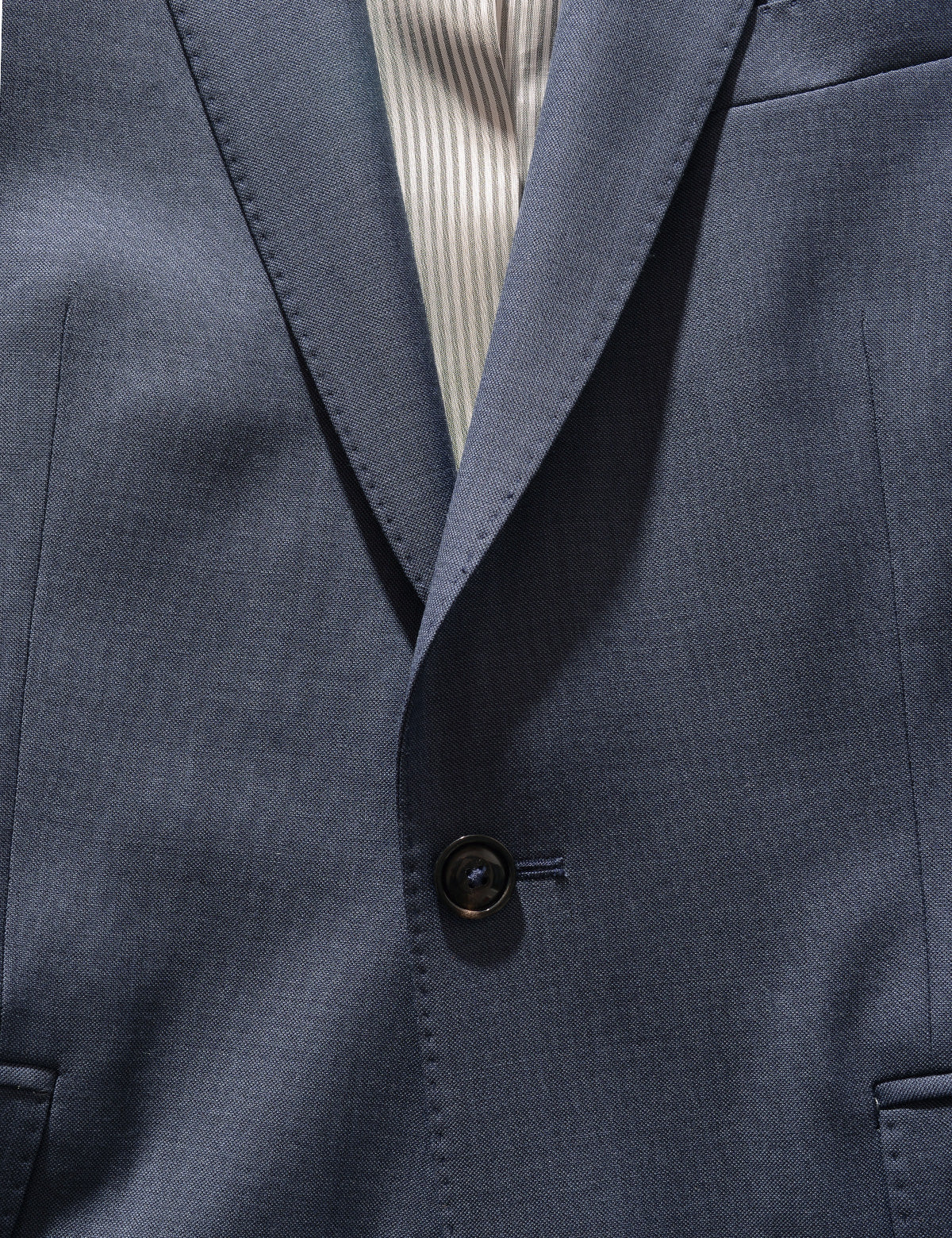 Detail shot of Brooklyn Tailors BKT50 Tailored Jacket in Wool Sharkskin - Haze Blue showing label, lining, and button