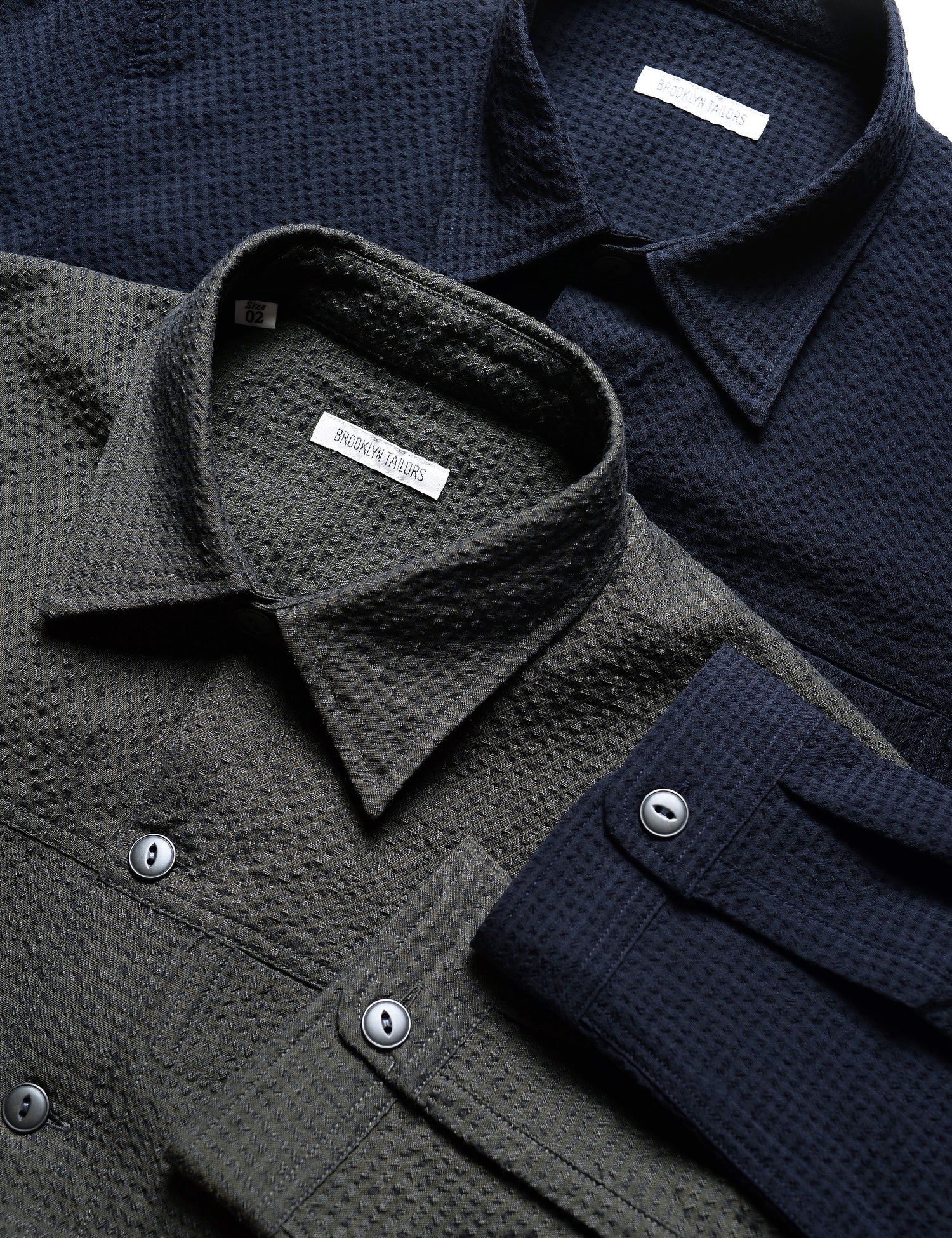 Detail shot of the collars and cuffs of two colors of Brooklyn Tailors BKT15 Shirt Jackets in Crinkled Wool & Cotton