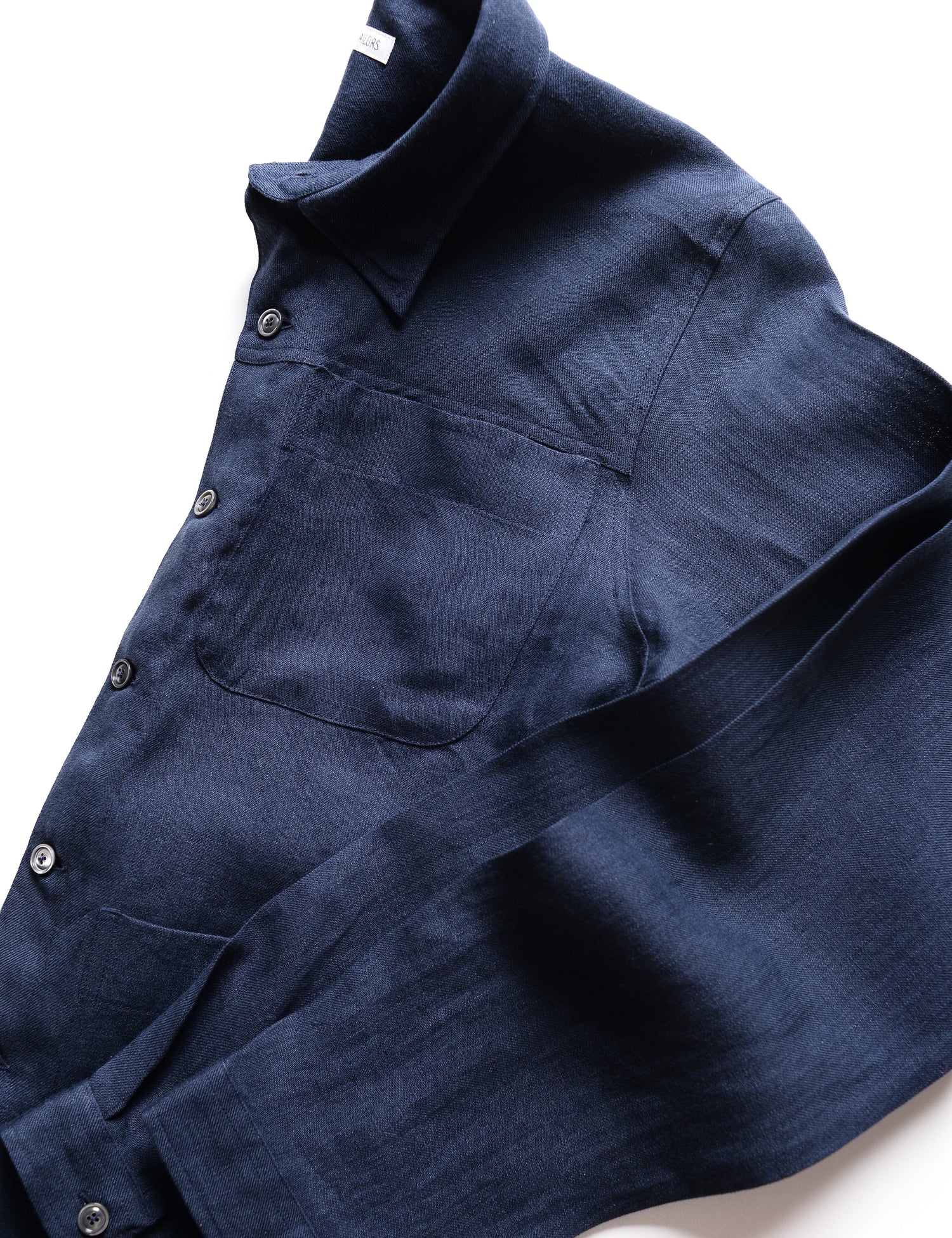 Detail of sleeve and buttons of Brooklyn Tailors BKT15 Shirt Jacket in Linen Twill - Salerno Blue