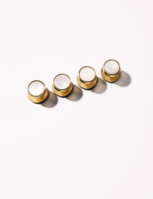 Flat shot of Brooklyn Tailors Mother of Pearl & Brass Dress Studs