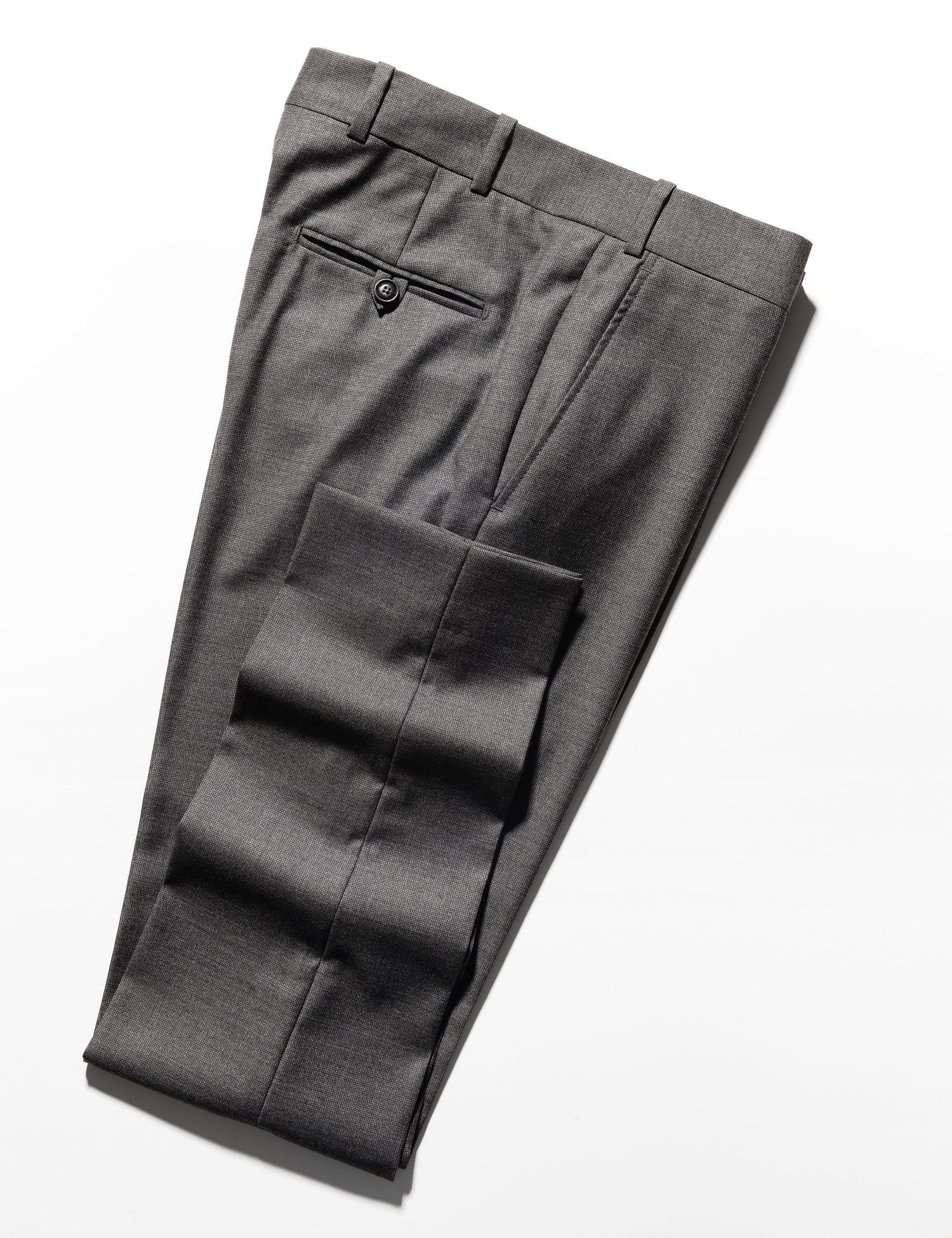 Folded shot of BKT50 Tailored Trousers in Wool Tickweave - Deep Gray showing hem, back pocket, and waistband