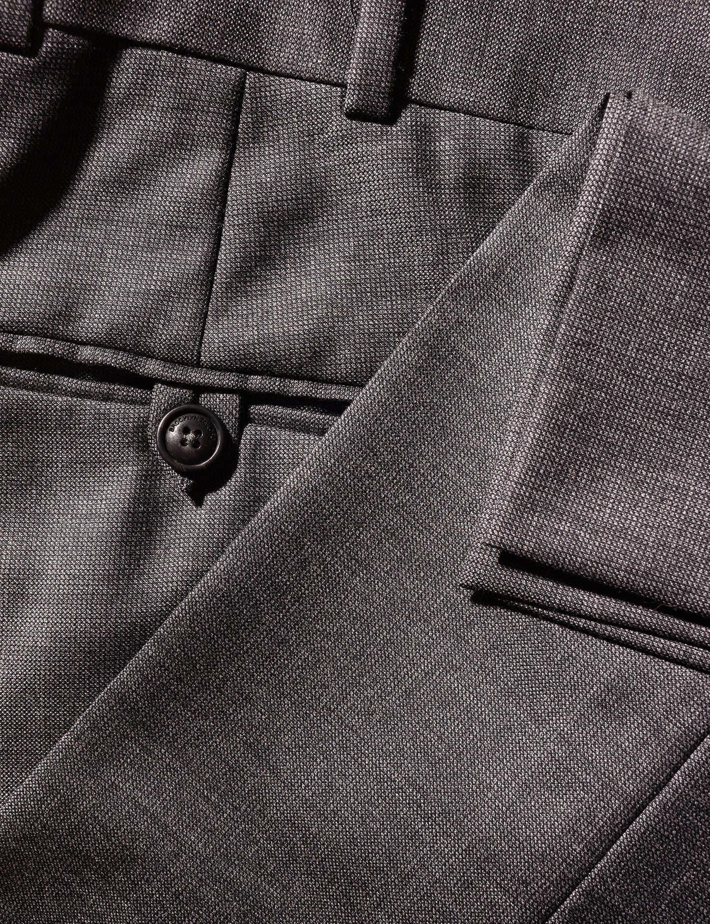 Close up of BKT50 Tailored Trousers in Wool Tickweave - Deep Gray showing back pocket and hem