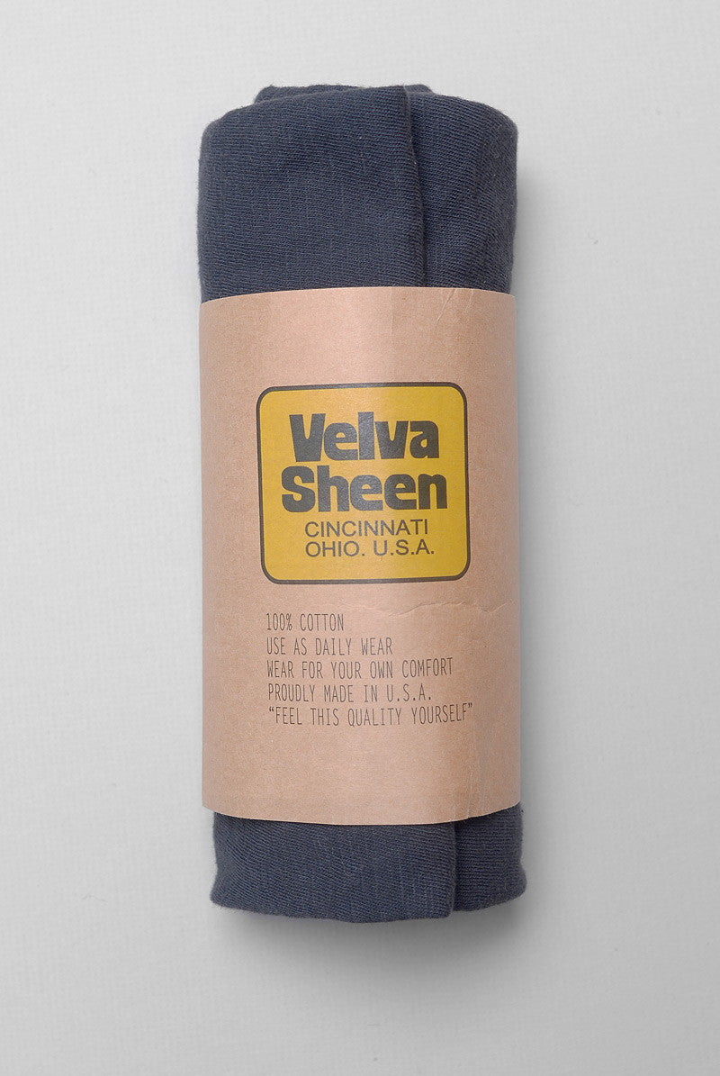 Photo of Velva Sheen Crewneck T-Shirt in Washed Black rolled in its paper packaging
