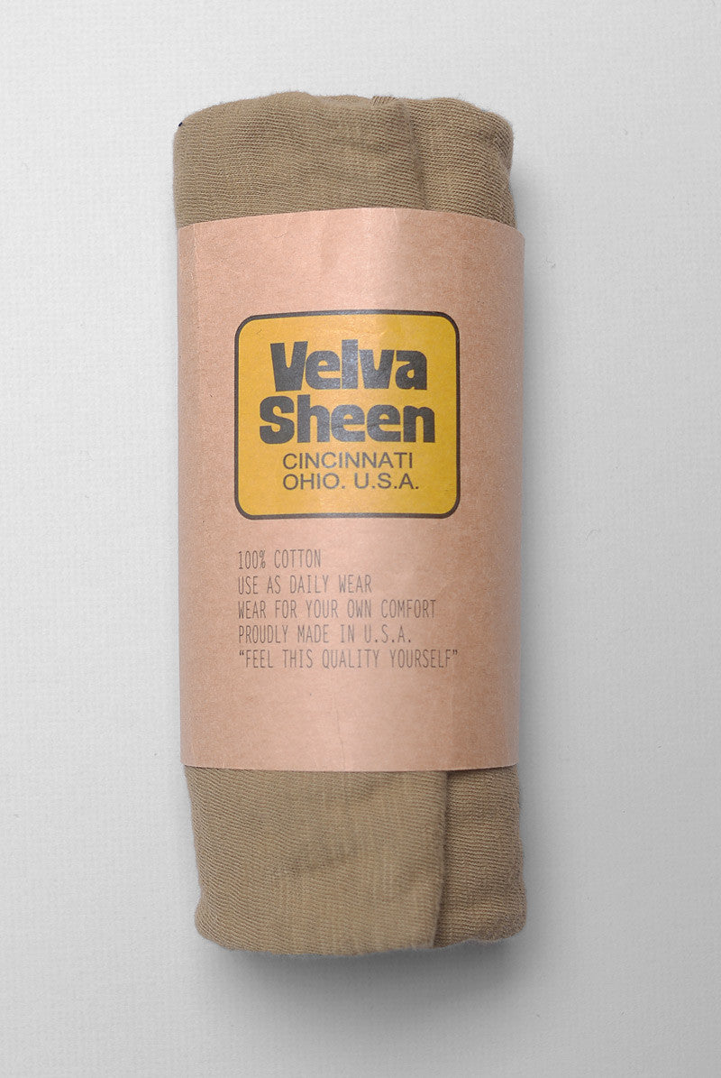 Photo of Velva Sheen Crewneck T-Shirt in Olive rolled in its paper packaging