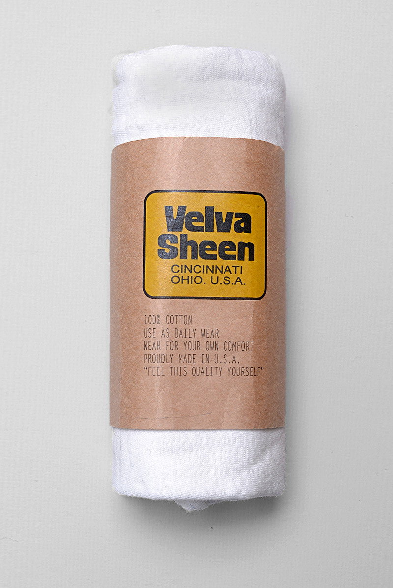 Photo of Velva Sheen Crewneck T-Shirt in Vintage White rolled in its paper packaging