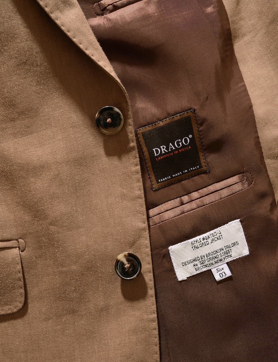 Detail shot of Brooklyn Tailors BKT50 Tailored Jacket in Wool Linen - Sahara showing Drago label and buttons