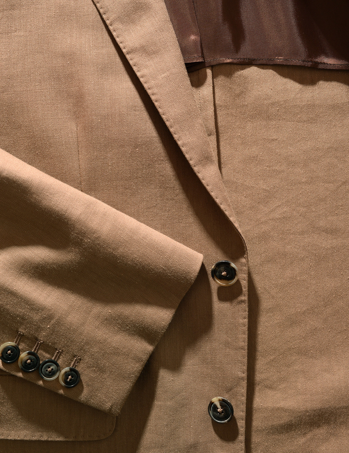 Detail shot of Brooklyn Tailors BKT50 Tailored Jacket in Wool Linen - Sahara showing cuff, lapel, and buttons